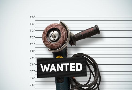 Kværner interaction. Plakat med et en vinkelkutter med teksten «Wanted» stort på en plakat foran kutteren. Viser til amerikanske mugshots.